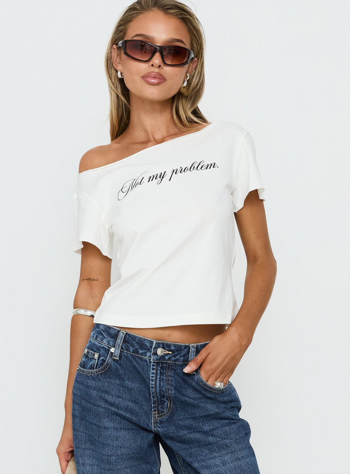 Not My Problem Loose Graphic Baby Tee White