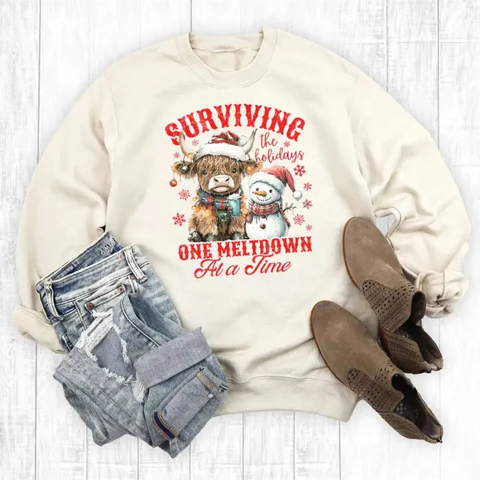 Women's Western Christmas Surviving One Meltdown Sweatshirt in Sweet Cream