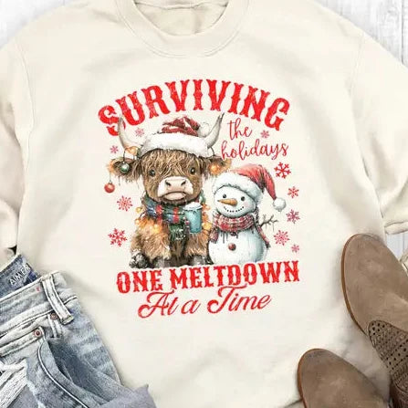 Women's Western Christmas Surviving One Meltdown Sweatshirt in Sweet Cream